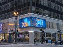 Transparent LED displays on glass facades use natural convection cooling for reliable outdoor operation